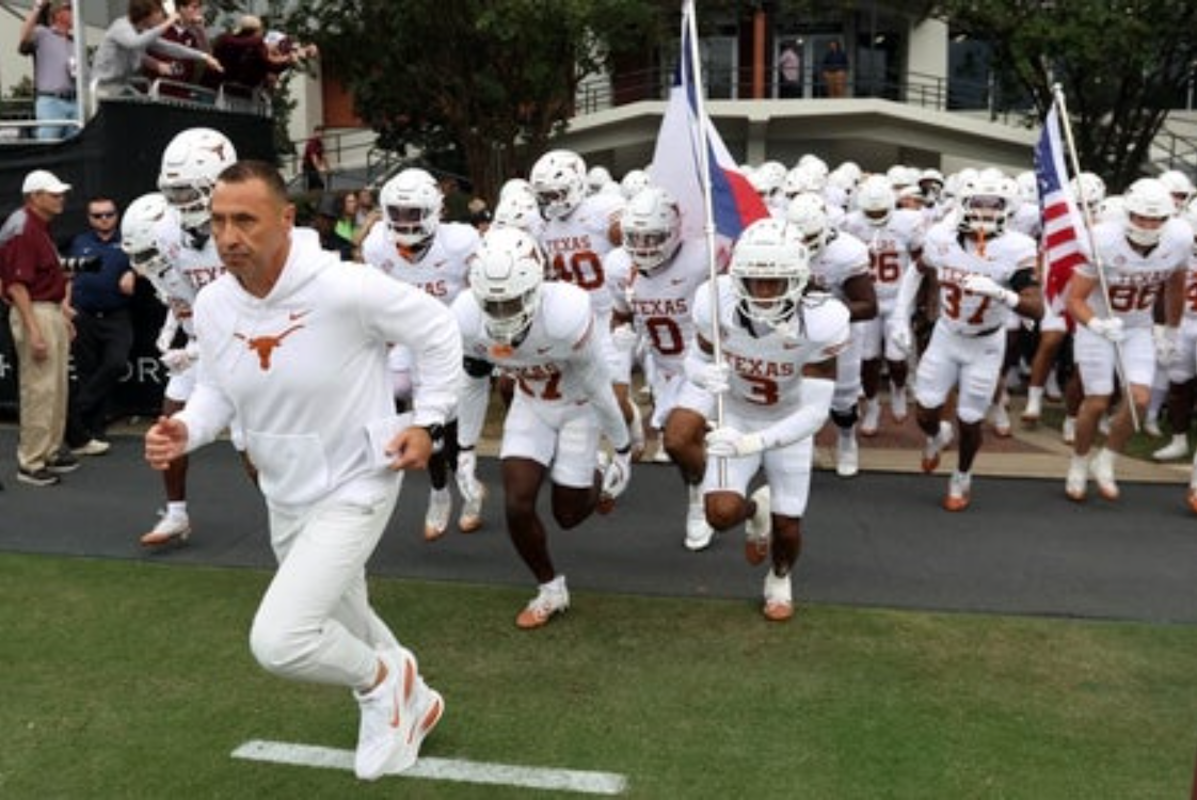 Oct 25, 2025; Starkville, Mississippi, USA; Texas Longhorns head coach Steve Sarkisian leads his team onto the field prior to the game against the Mississippi State Bulldogs at Davis Wade Stadium at Scott Field. Mandatory Credit: Petre Thomas-Imagn Images
